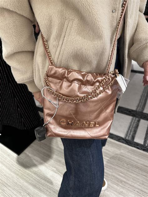 small chanel black purse|Chanel mini 22 pink.